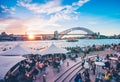 Famous sunset over Sydney Harbour Bridge. Stunning view of the waterfront near the Opera house. Royalty Free Stock Photo