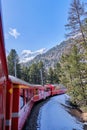 The famous Swiss mountain train of Bernina Express crossed italian and swiss Alps