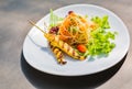 Famous Thai papaya salad or Somtum with Chicken satay on side