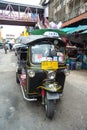 Famous three-wheeled taxi (tuktuk) parking at the street