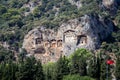 Famous tombs carved inside rocks in ancient Kaunos city, Turkey. Lycian Royal mountain tombs carved into the rocks near the town o Royalty Free Stock Photo