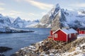 Famous tourist attraction Hamnoy fishing village on Lofoten Islands, Norway with red rorbu houses in winter. Royalty Free Stock Photo