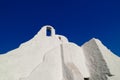 Famous tourist landmark, Mykonos island, Greece. White Greek Orthodox church of Panagia Paraportiani at sunrise. Upshot Royalty Free Stock Photo