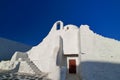 Famous tourist landmark, Mykonos, Greece. White Greek Orthodox church of Panagia Paraportiani, town of Chora on island Royalty Free Stock Photo
