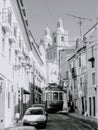 Famous touristic tram on the narrow Lisbon street. Portugal Royalty Free Stock Photo