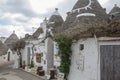 Famous touristic walking path in Alberobello trulli town with souvenir shops