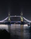 Famous Tower Bridge over Thames River in London, UK ay nighttime