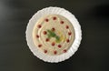 Dip Tahini with pomegranate on dark wooden background. Top view. Tahina sauce. Royalty Free Stock Photo