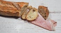 The famous traditional and authentic Artisan French bread, with a slice of french ham rolled up