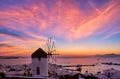 Famous traditional Greek windmill, Mykonos, Greece at sunset sky. Beautiful landscape, Chora, main town of island, in Royalty Free Stock Photo