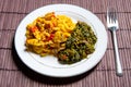 Famous traditional Jamaican ackee & saltfish breakfast, steamed callaloo seasoned with tomatoes, thyme, onions, escallion.