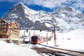 Famous train Jungfrau railway goes to Alpine mountain resort w