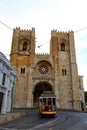 Famous tram line 28 passing in front of Cathedral of St. Mary Major Se de Lisboa in Lisbon, Portugal Royalty Free Stock Photo