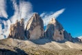 Famous Tre Cime di Lavaredo with blue sky, Dolomites Alps, Italy Royalty Free Stock Photo