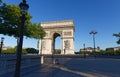 The famous Triumphal Arch at sunny day , Paris, France.