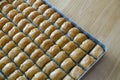 Famous Turkish baklava dessert sliced in a baking tray, Gaziantep baklava