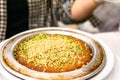 Famous turkish desserts kunefe with cheese, walnut and pistachios