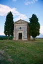 Famous Tuscan church with two cypress trees Royalty Free Stock Photo