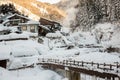 A famous valley hot spring covered in snow at Yamanouchi in Nagano. Royalty Free Stock Photo