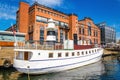 Famous view of Aker Brygge Oslo with white yacht Royalty Free Stock Photo