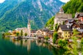 Famous view of Hallstatt city and church near the lake. Mountains in the background. Summer rainy day, soft colors, cloudy weather Royalty Free Stock Photo