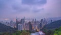 The famous view of Hong Kong from Victoria Peak night to day timelapse. Taken before sunrise with colorful clouds over
