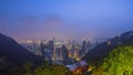 The famous view of Hong Kong from Victoria Peak night to day timelapse. Taken before sunrise with colorful clouds over Royalty Free Stock Photo