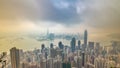 The famous view of Hong Kong from Victoria Peak timelapse. Taken at sunrise with colorful clouds over Kowloon Bay. Royalty Free Stock Photo