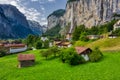 View of Lauterbrunnen town in Swiss Alps valley with gorgeous Staubbach waterfalls in the background, Switzerland Royalty Free Stock Photo