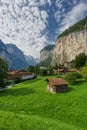 Famius view of Lauterbrunnen town in Swiss Alps valley with gorgeous Staubbach waterfalls in the background, Switzerland Royalty Free Stock Photo