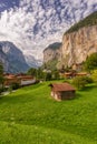 Famous view of Lauterbrunnen town in Swiss Alps valley with gorgeous Staubbach waterfalls , Switzerland Royalty Free Stock Photo