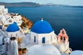 Famous view from viewpoint of Santorini Oia village with blue dome of greek orthodox Christian church Royalty Free Stock Photo