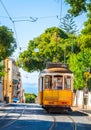 Famous vintage tram in the street of Alfama, Lisbon, Portugal