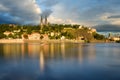 Famous Vysehrad church during sunny day. Amazing cloudy sky in motion. Vltava river, Prague, Czech republic