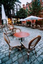 Famous Water Castle Restaurant in Speicherstadt, Outside. Tables and chairs at cobbled square. Hamburg, Germany