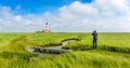 Famous Westerheversand lighthouse at North Sea, Schleswig-Holstein, Germany