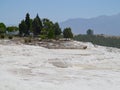 Famous white calcium travertines and pools in Pamukkale, Turkey.