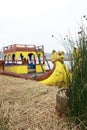 The famous yellow boats made of reeds by the native indians of Lake Titicaca in Peru, South america