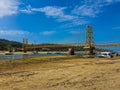 Famous yellow bridge connecting two Islands ( Lambongan and Ceningan ) in Bali, Indonesia with a blue sky. Royalty Free Stock Photo