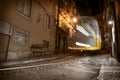 Famous yellow tram 28 in motion blur at night in Lisbon. long exposure of tram in old part of city Royalty Free Stock Photo