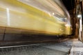 Moving yellow tram in old part of Lisbon at night. Blurred in motion, long exposure Royalty Free Stock Photo