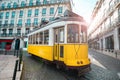 A famous yellow tram on a sunny summer day in Lisbon city old town, Portugal. Trams in Lisbon. Tourist attraction Royalty Free Stock Photo