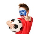 Fan boy player hold soccer ball celebrating happy laughing showing thumbs up sign with russian flag on face Royalty Free Stock Photo