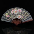 Fan with Chinese painting close-up. Royalty Free Stock Photo