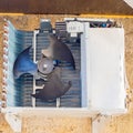 Fan in the compressor installation of an air conditioner hanging from the outside of the building on the wall Royalty Free Stock Photo