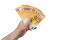 A fan of 50 fifty euros. The hand of a European man holds a fan of European money. Isolated white background. Royalty Free Stock Photo