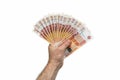 A fan of 5,000 five thousand rubles. The hand of a European man holds a fan of Russian money. Isolated white background.