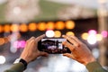 Fan at outdoor music festival taking pictures and making videos using his smartphone Royalty Free Stock Photo