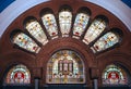 Decorative colorful stained glass in arches in historic shopping arcade of Queen Victoria Building QVB in Sydney CBD, Australia