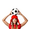 Fan sport woman player in red uniform and russian winter hat hold soccer ball celebrating Royalty Free Stock Photo